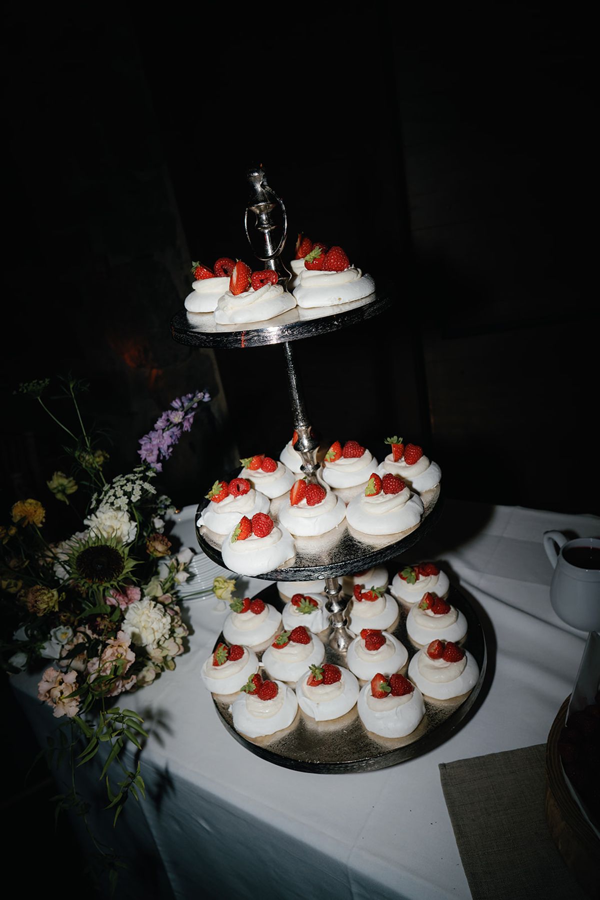 A tiered stand of strawberry desserts