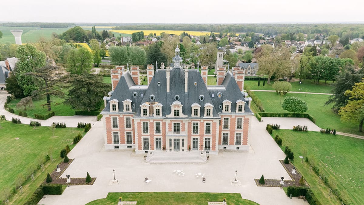 Aerial view of Chateau de Nainville-les-Roches and its formal parterre gardens