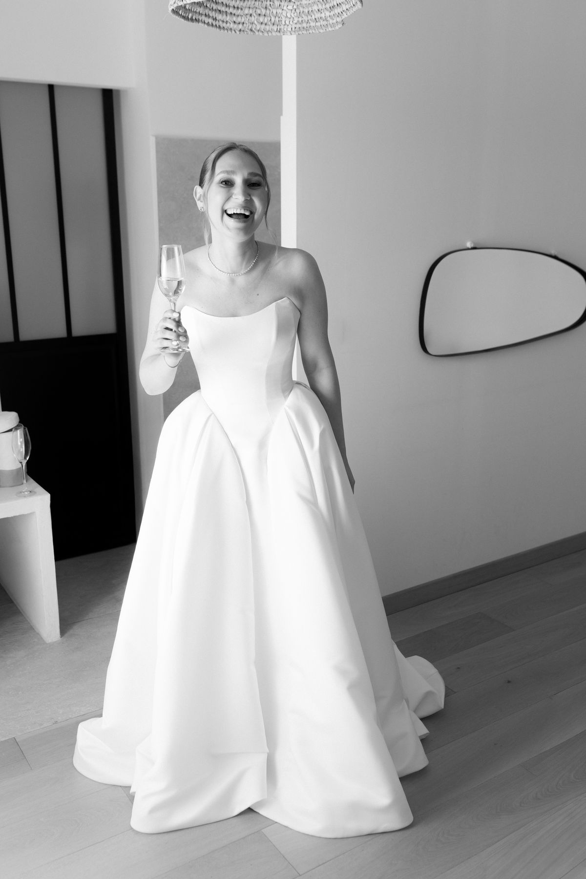 Bride adjusting her gown before the ceremony