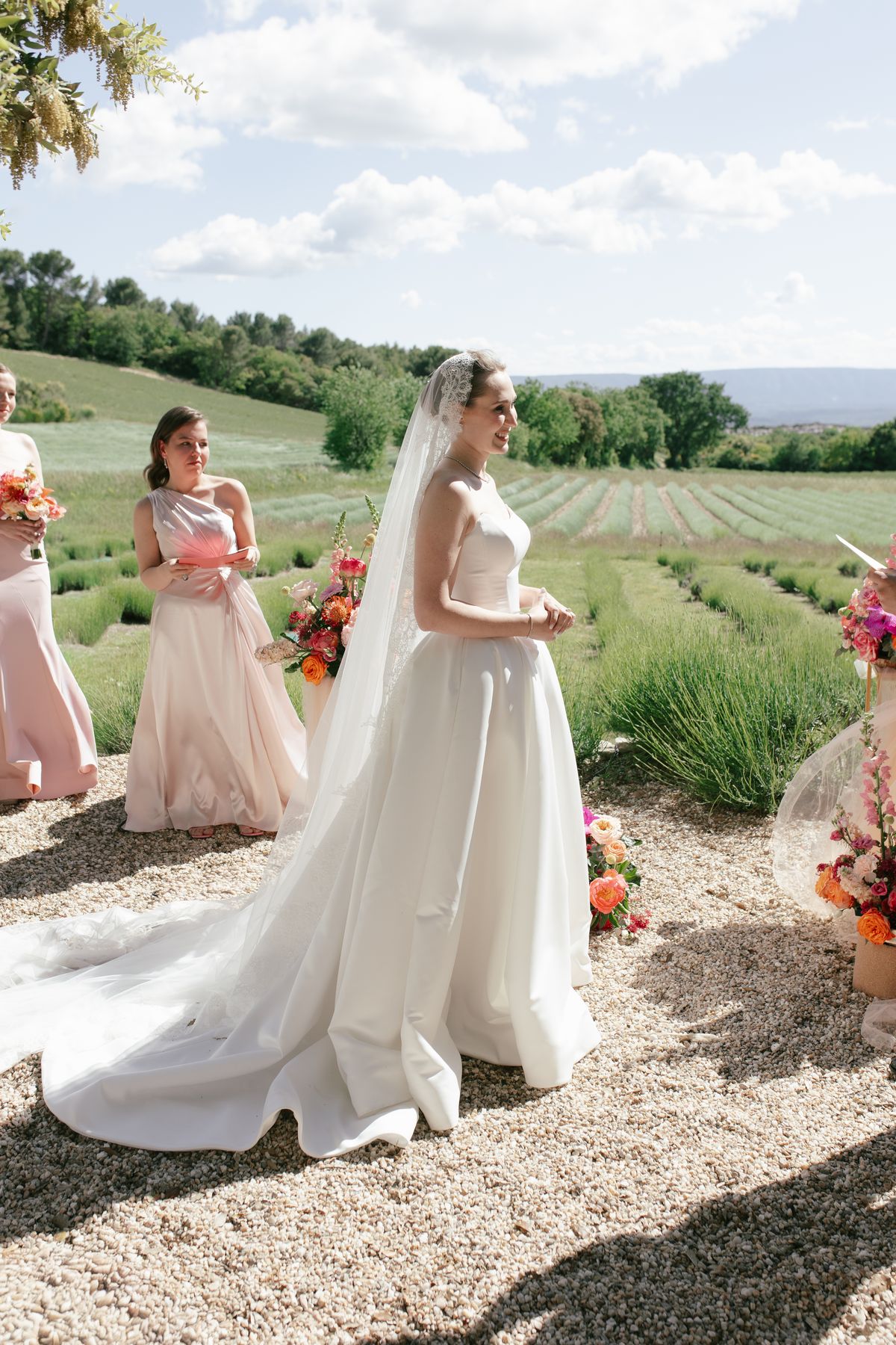 Bride standing with a bridesmaid in a lavender field