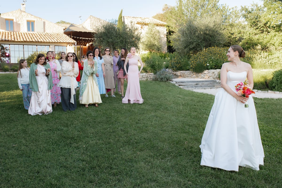 Guests gathered with the bride on the lawn at Mas de Florette