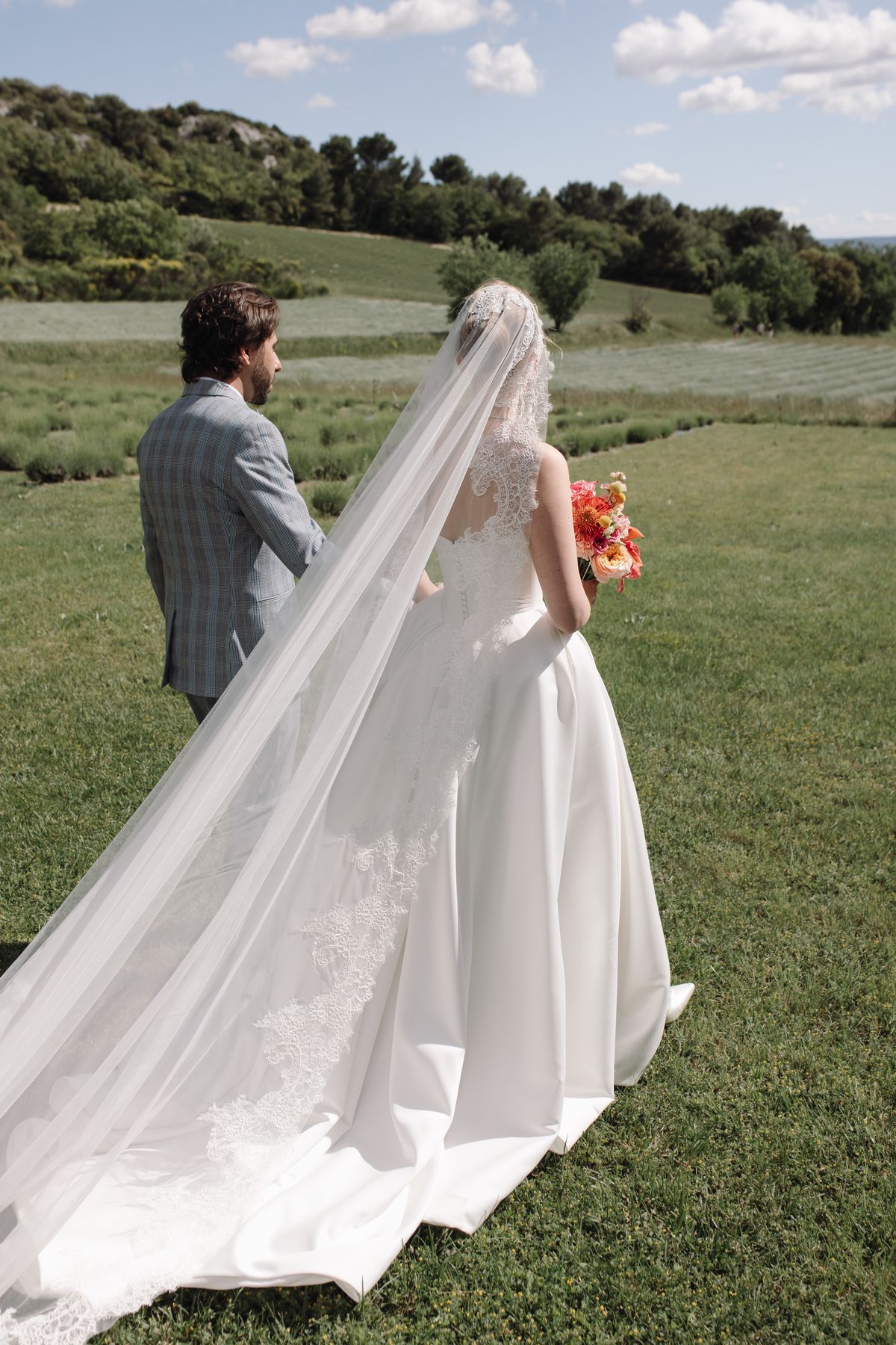 Bride from behind in her cathedral-length veil