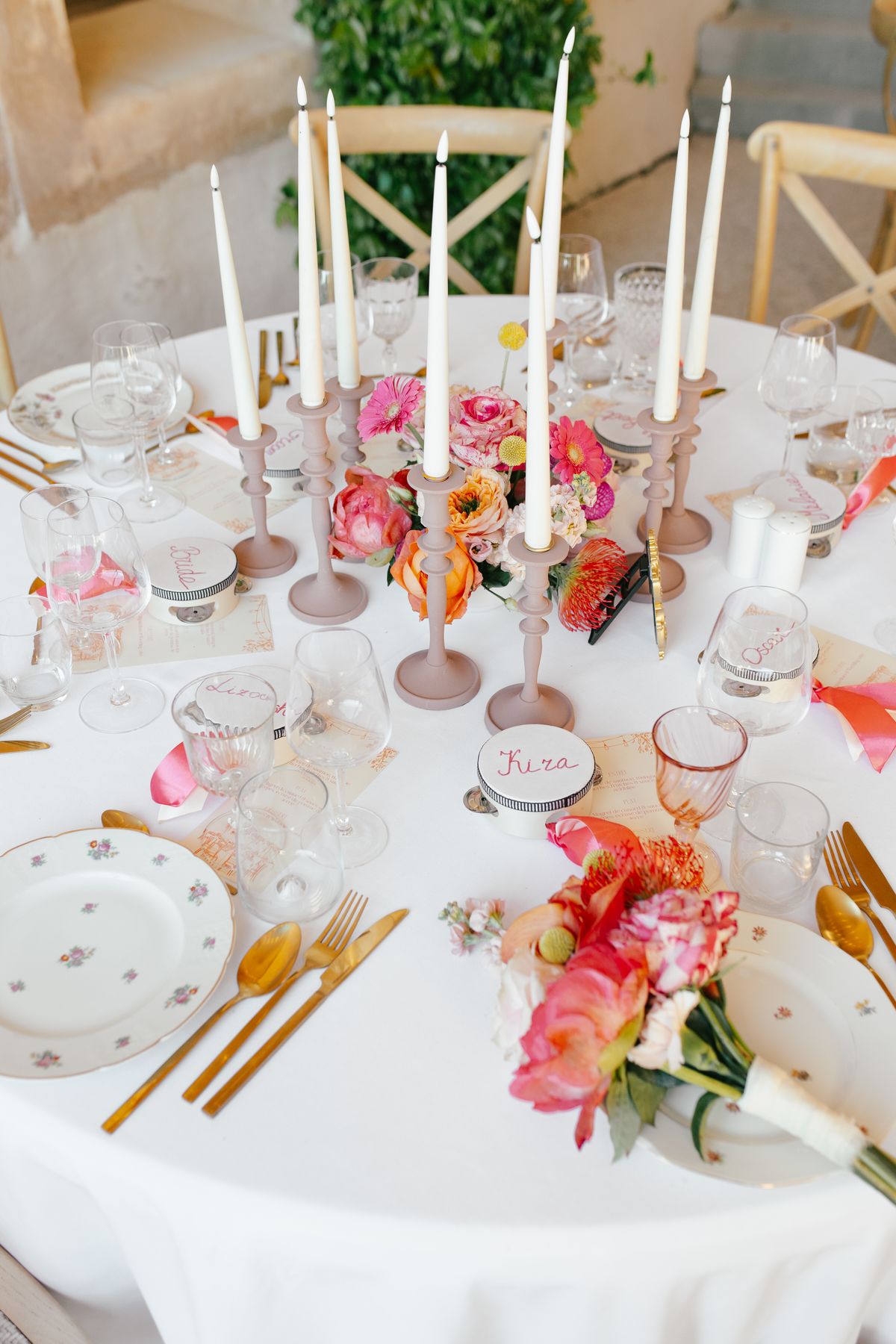 Reception table setting with pink and orange florals