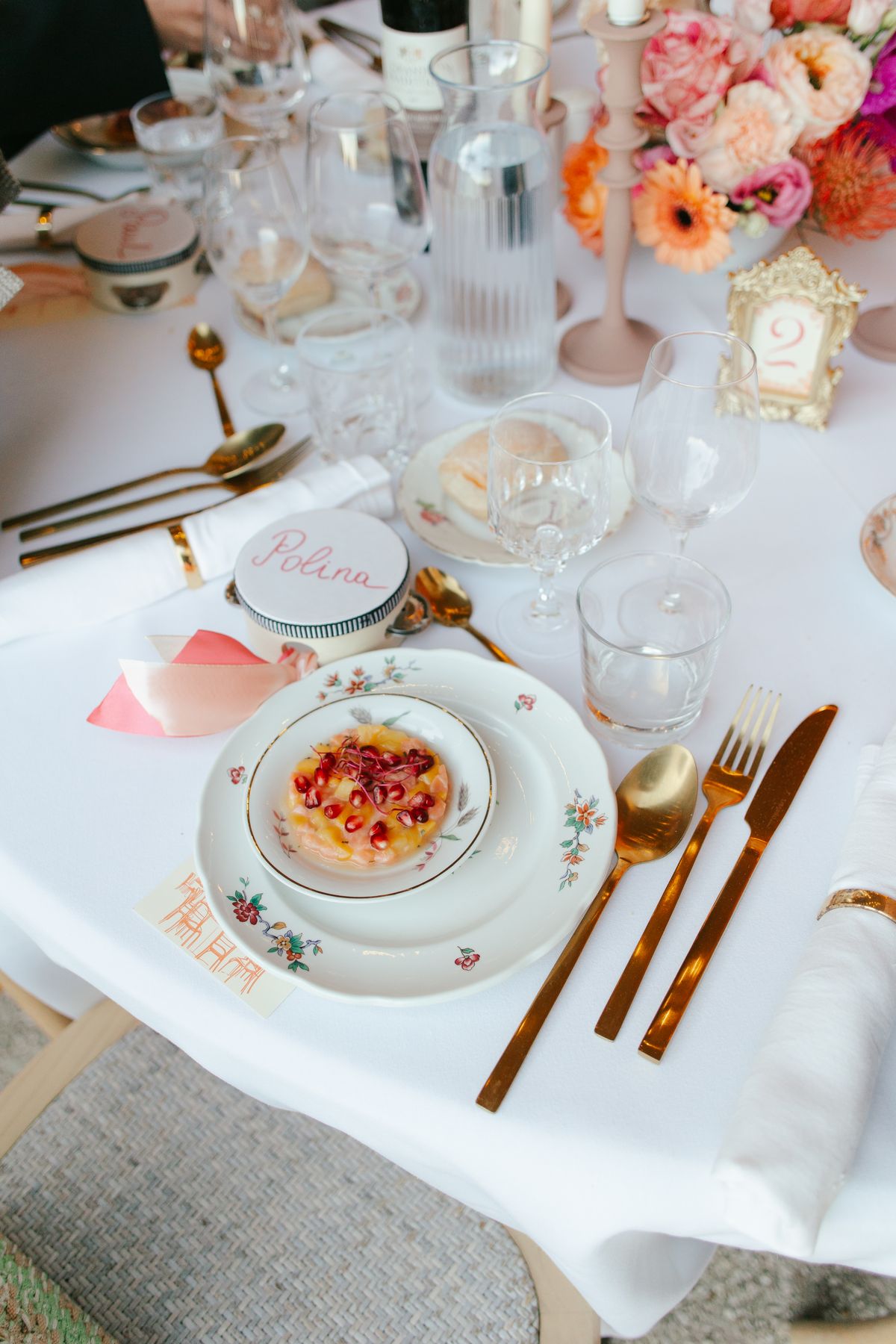 Place setting with a guest's name card and a dessert plate