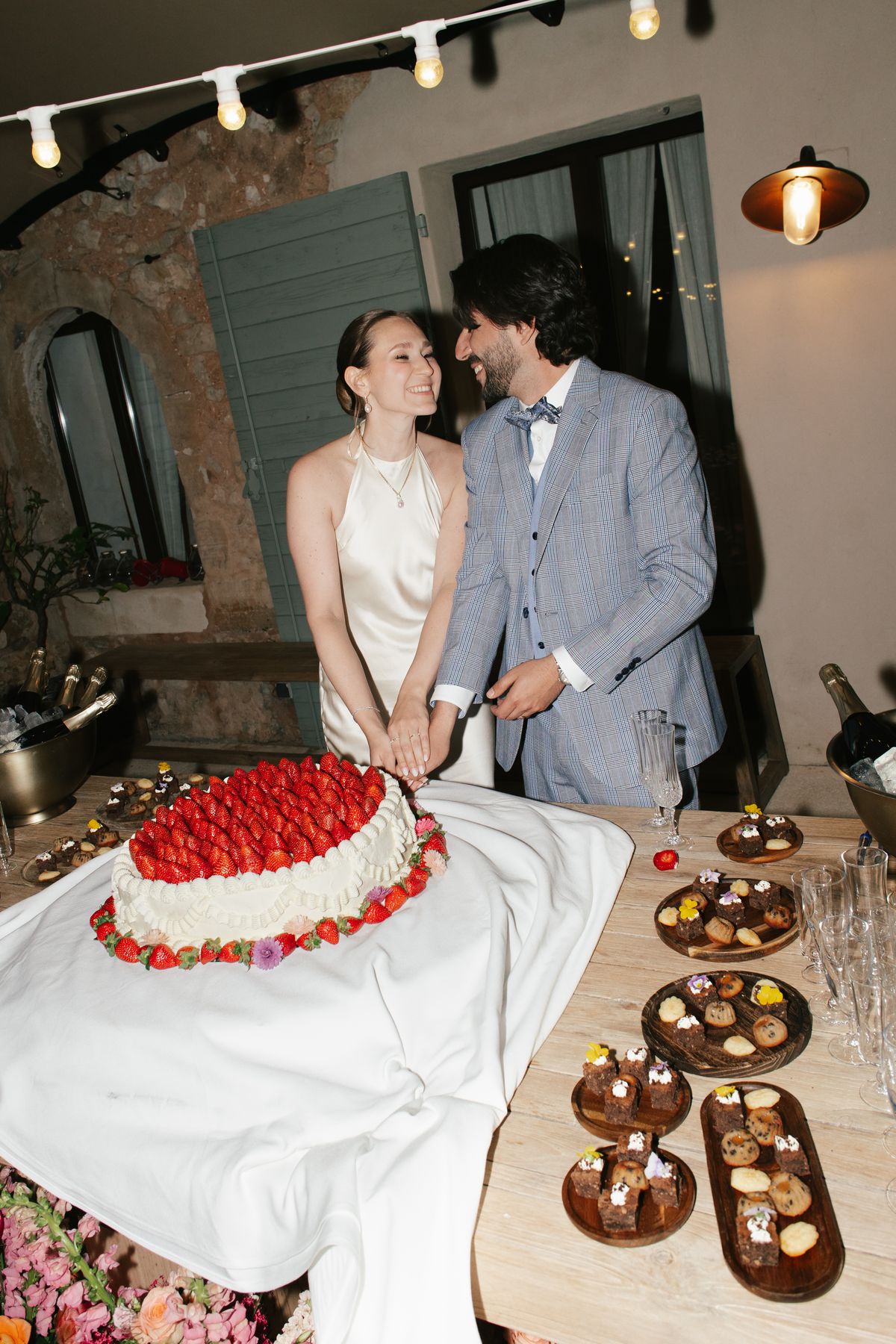 Bride and groom cutting their wedding cake