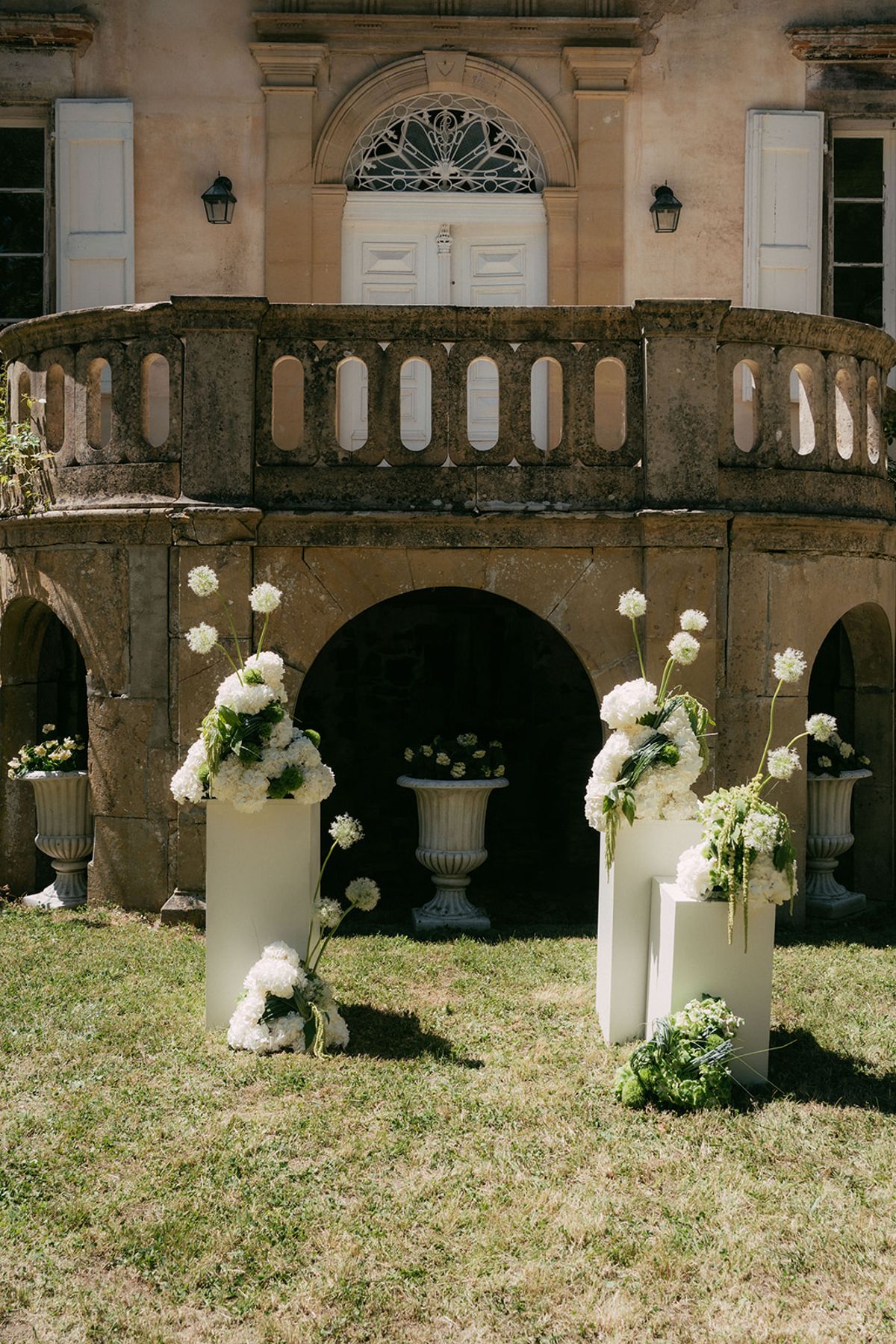 Floral plinths at the arcaded orangery, Chateau du Pont Bourguet