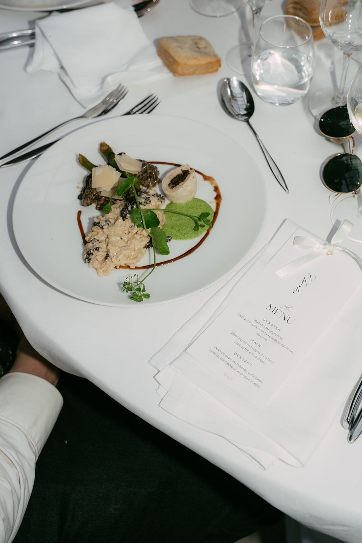 A plated course and the menu card at the wedding dinner