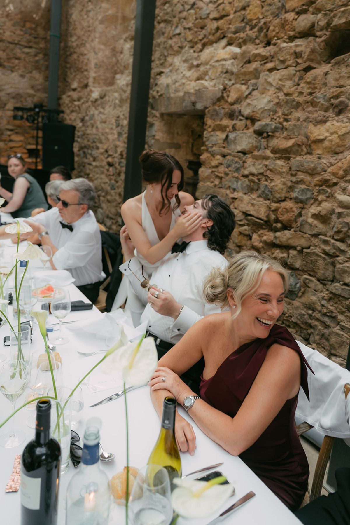 Guests together at the dinner table at Chateau du Pont Bourguet