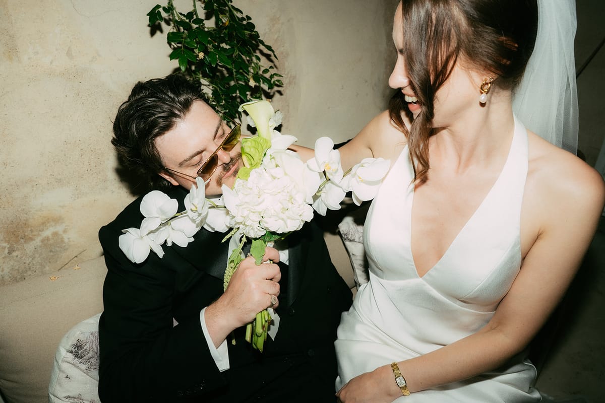 Jasmin and David together with her bouquet, shot on flash