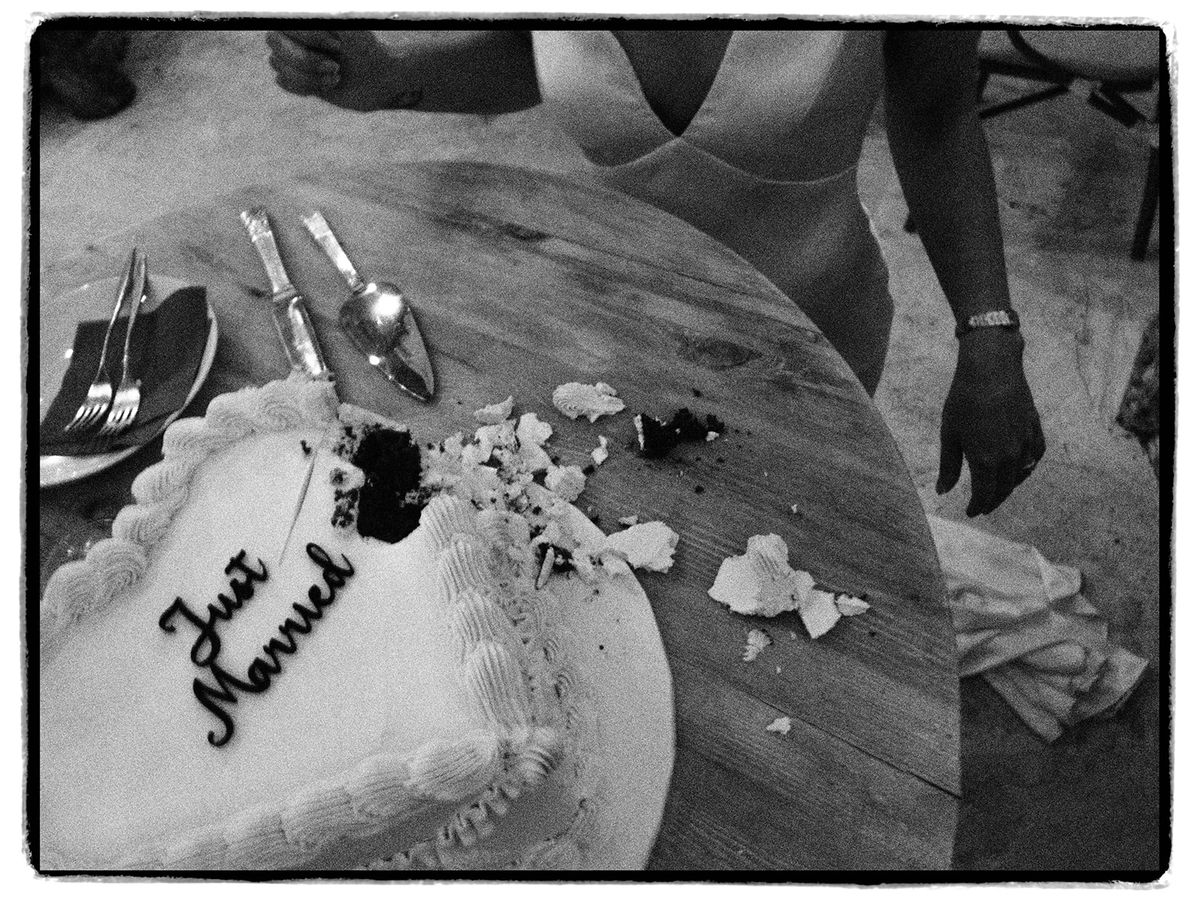 The cut Just Married cake at Chateau du Pont Bourguet