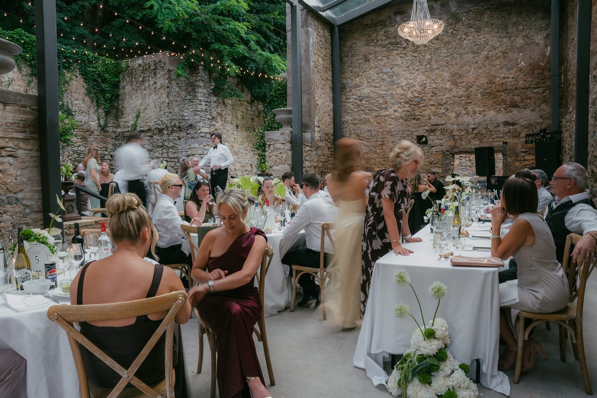 The barn dinner under festoon lights at Chateau du Pont Bourguet
