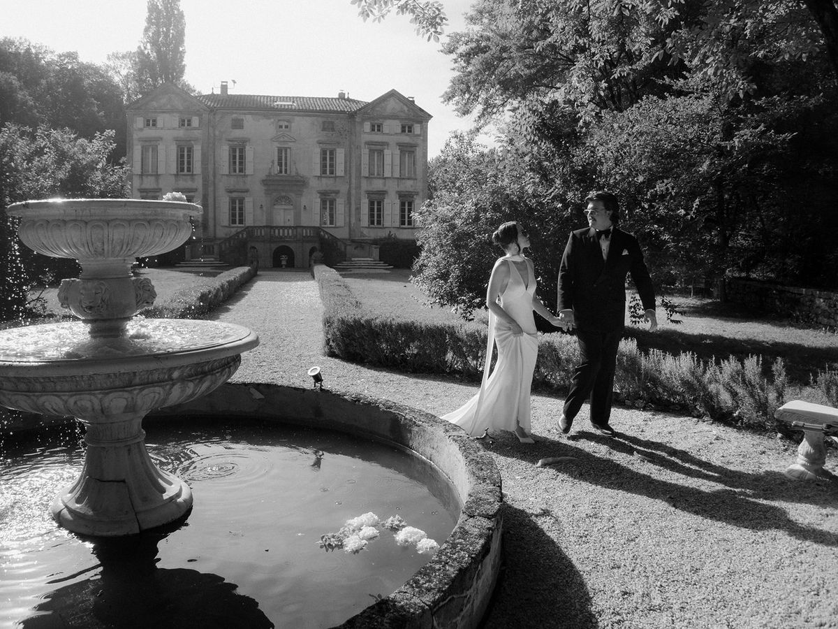 Chateau du Pont Bourguet beyond the stone fountain, Tarn