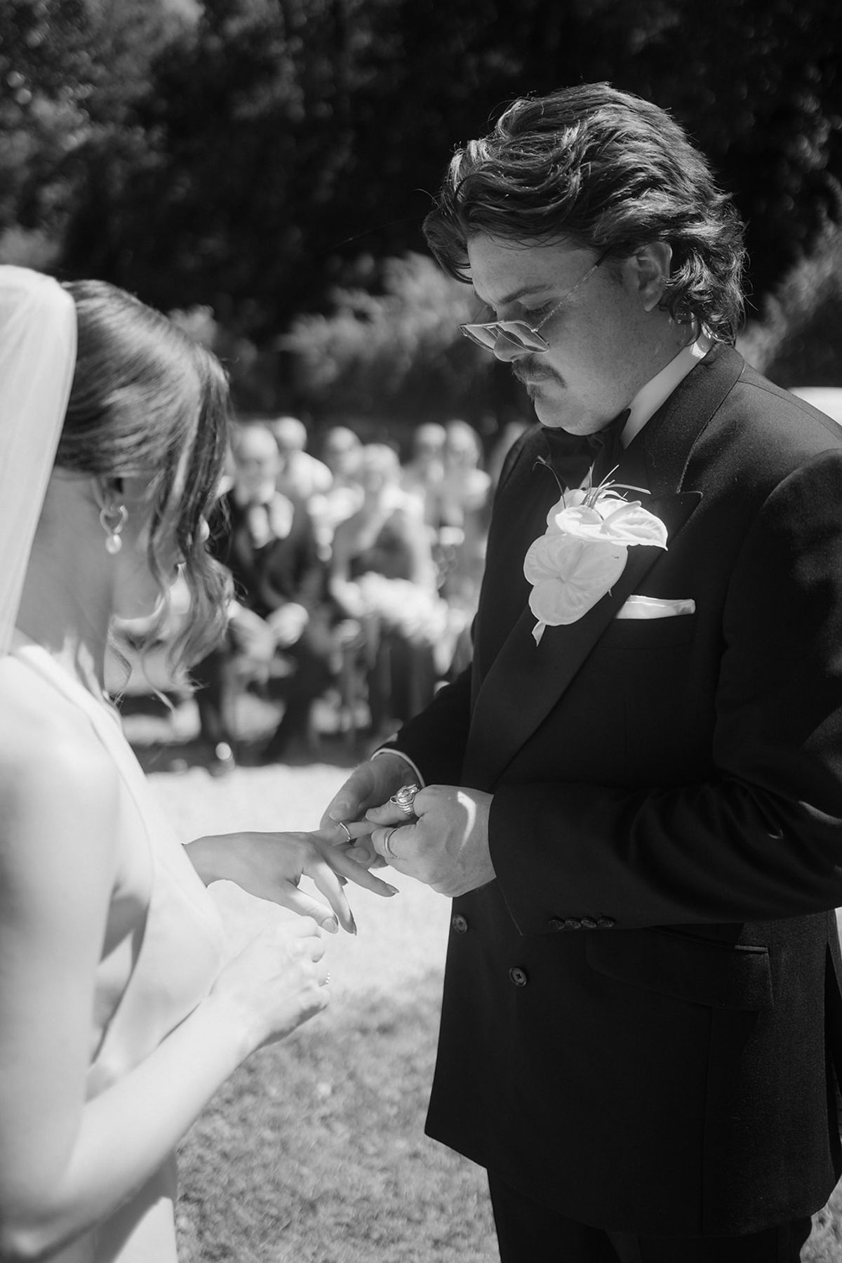 Exchanging rings during the summer ceremony at Chateau du Pont Bourguet