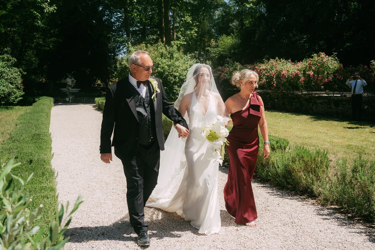 The bride walking down the aisle at Chateau du Pont Bourguet