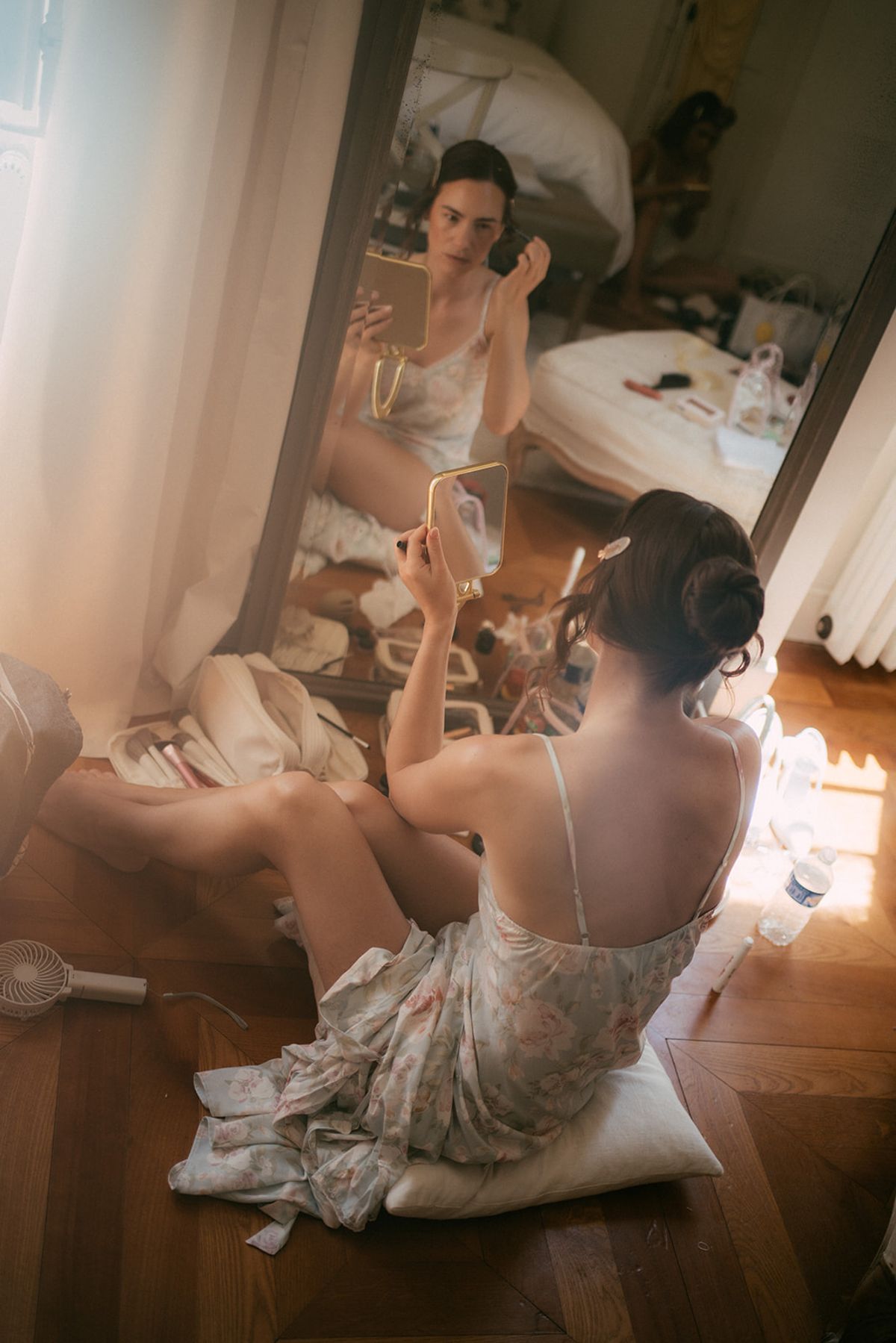 The bride having her hair finished on the morning of the wedding