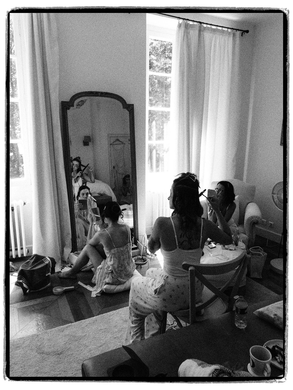 The bridal party getting ready in the chateau bedroom