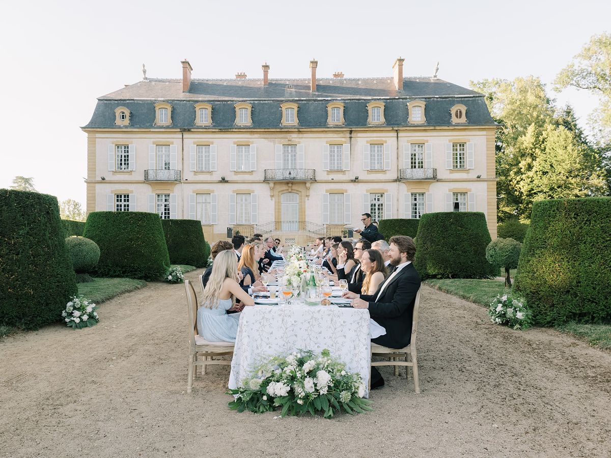 Dinner underway at the long table before the chateau