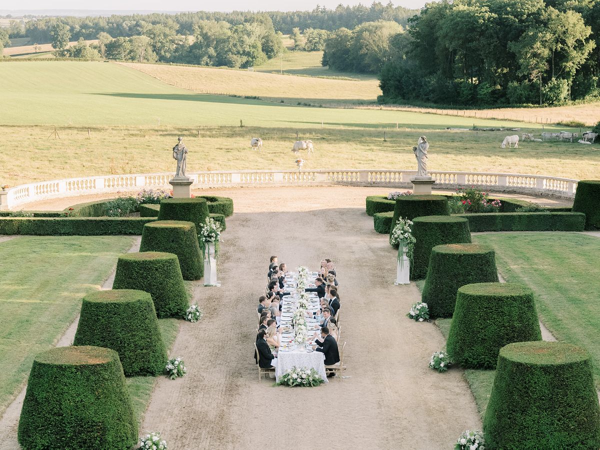 The dinner table drawn down the central axis of the garden