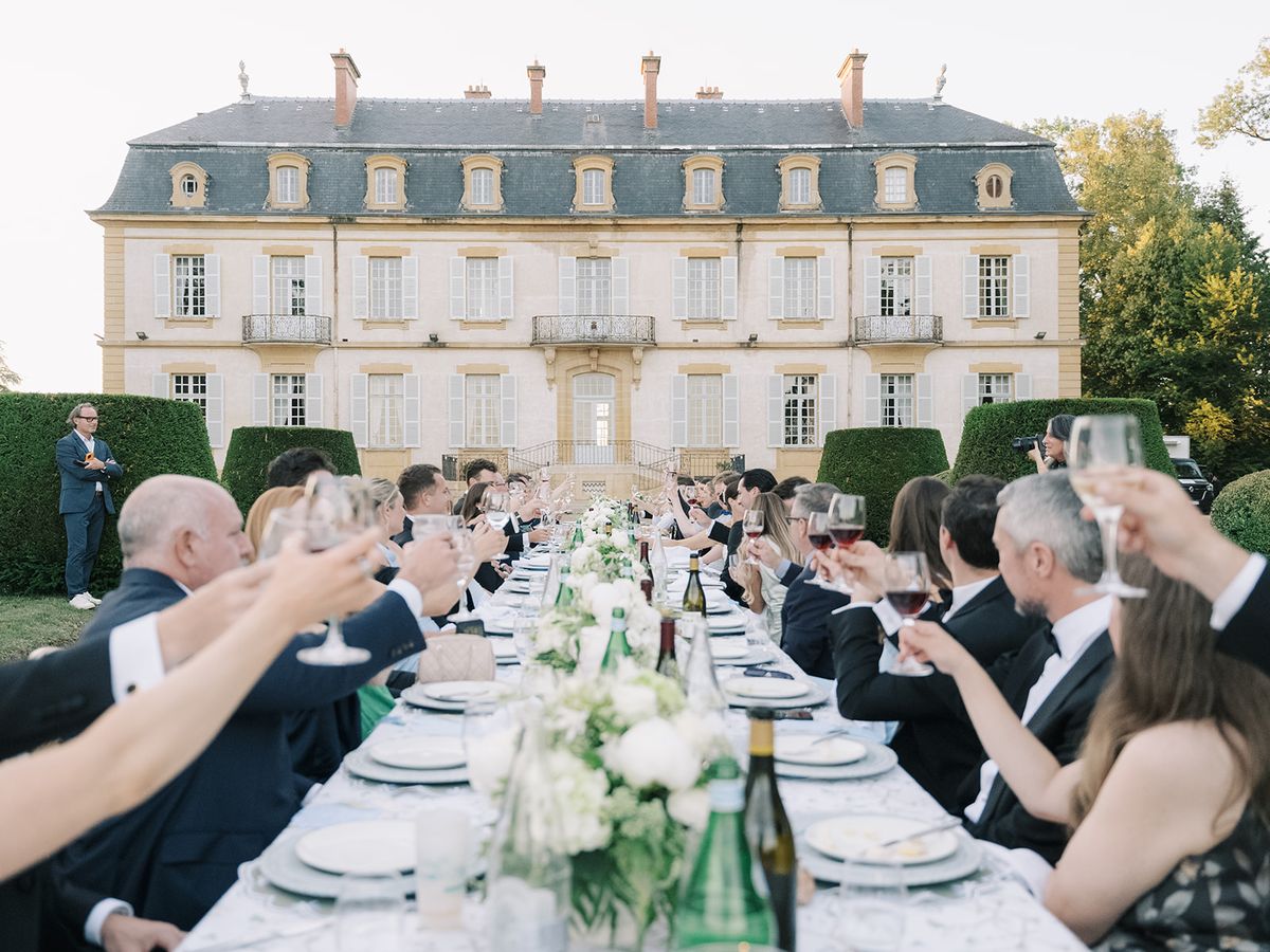 Guests raising their glasses for a toast