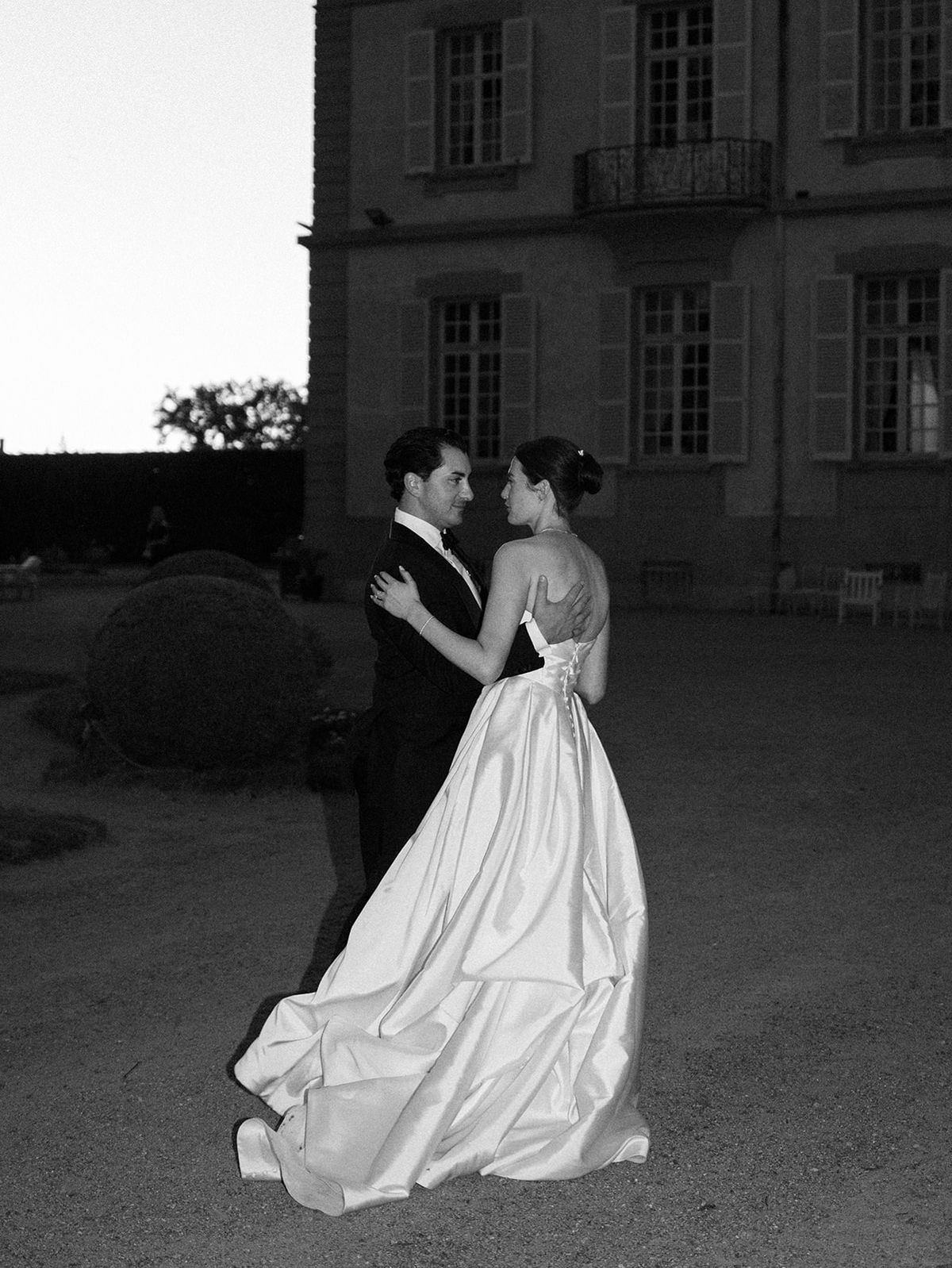 Haley and Tyler dancing in front of the chateau at dusk