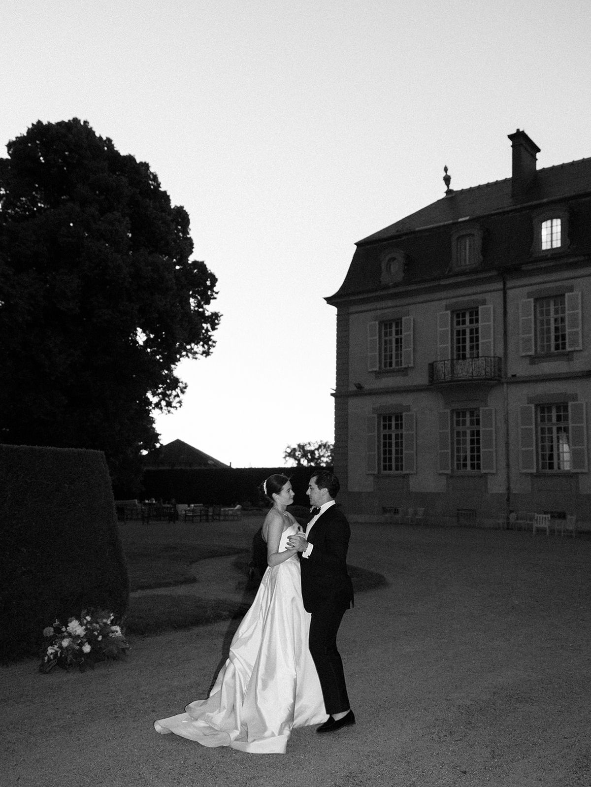 Haley and Tyler dancing on the gravel before the chateau
