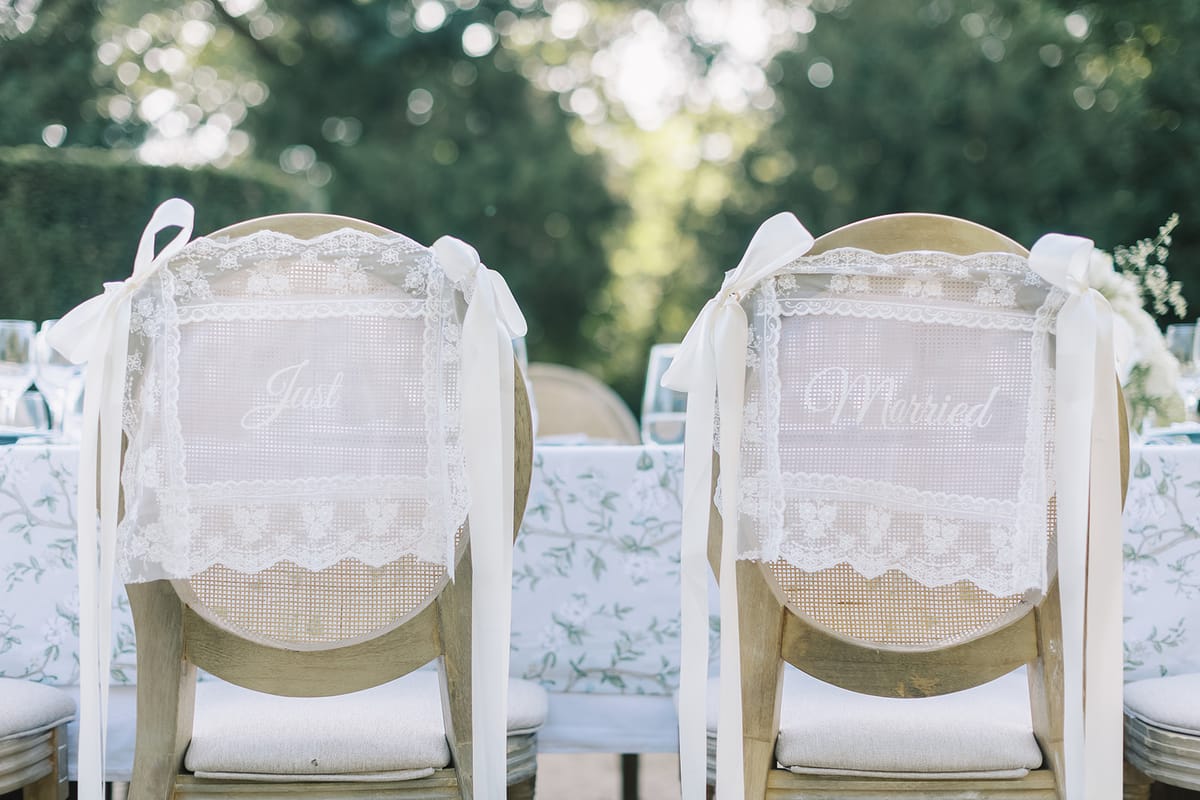 Lace chair backs marking the couple's seats
