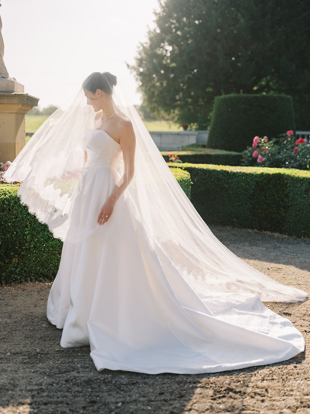 Haley in her lace edged veil in the gardens at La Chassagne