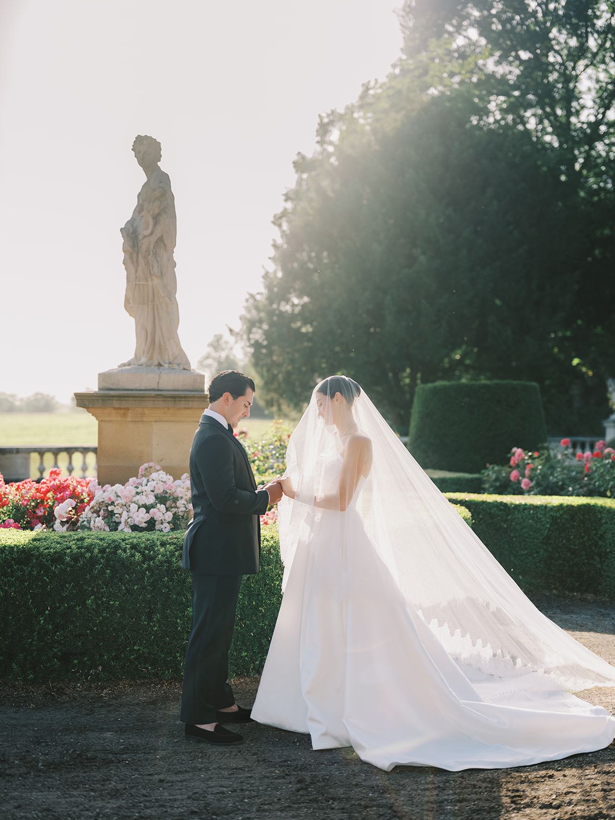 Haley and Tyler in the rose garden at golden hour