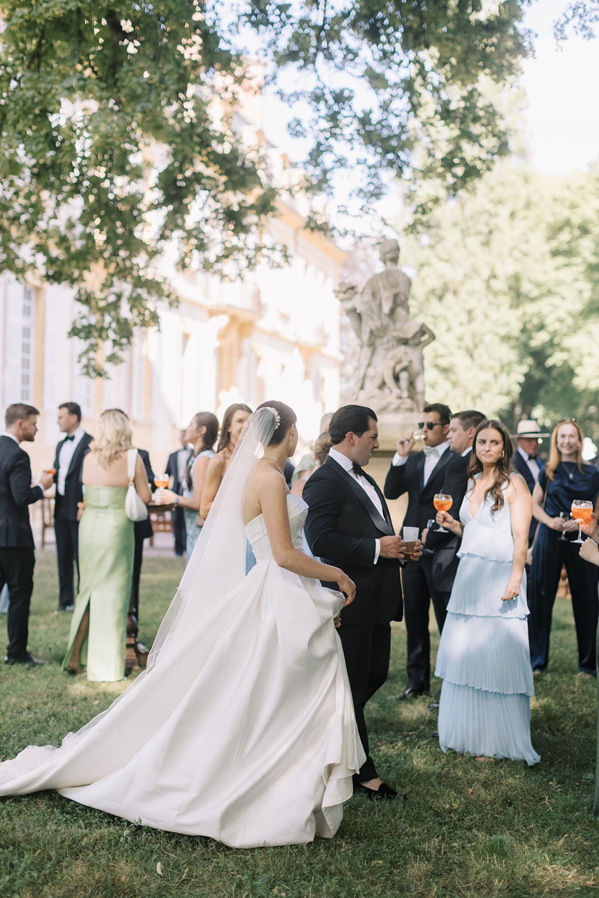 Haley and Tyler with guests during cocktails in the gardens