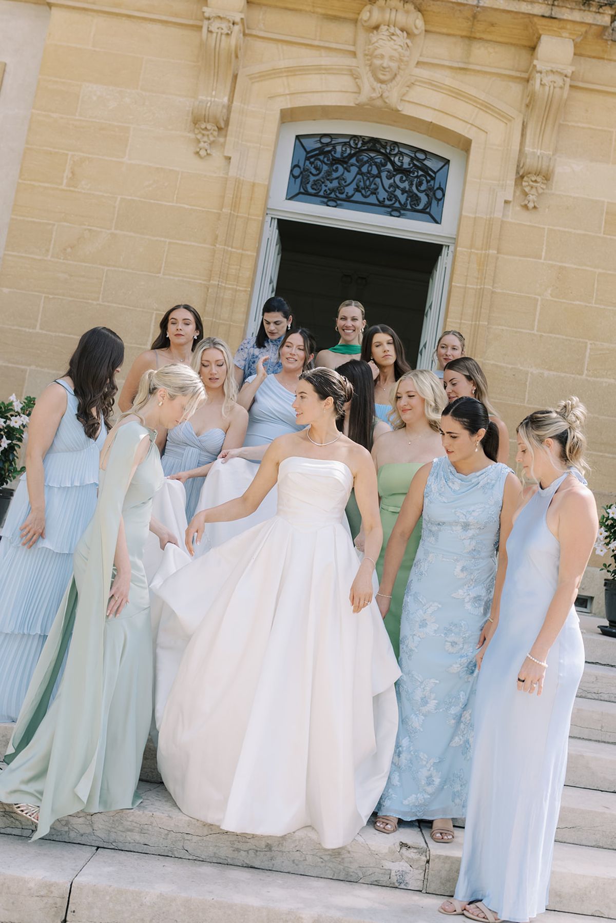 Haley and her bridesmaids on the chateau steps at La Chassagne