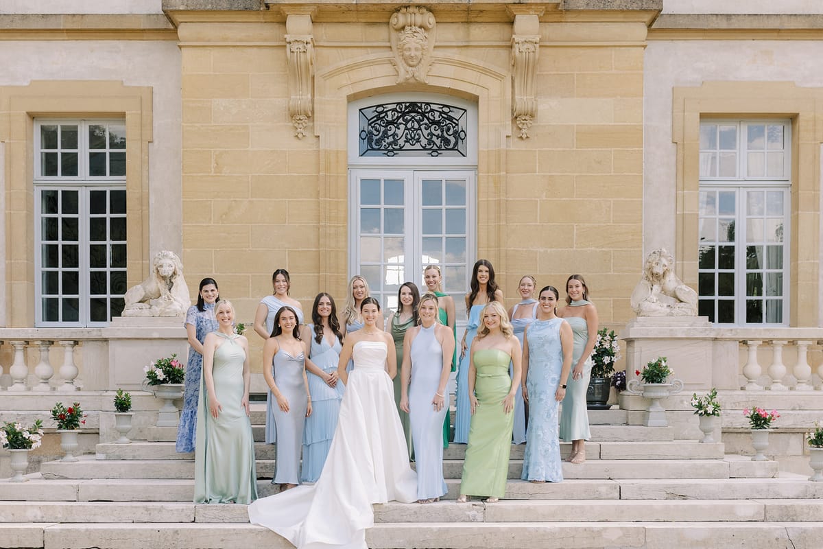 Haley and her bridesmaids gathered on the stone steps