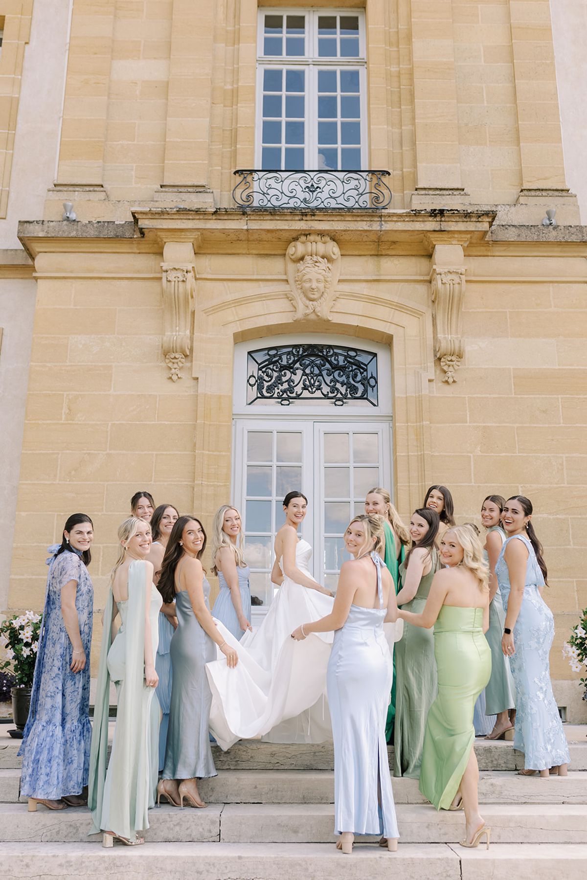 Haley with her bridesmaids, her train spread behind her