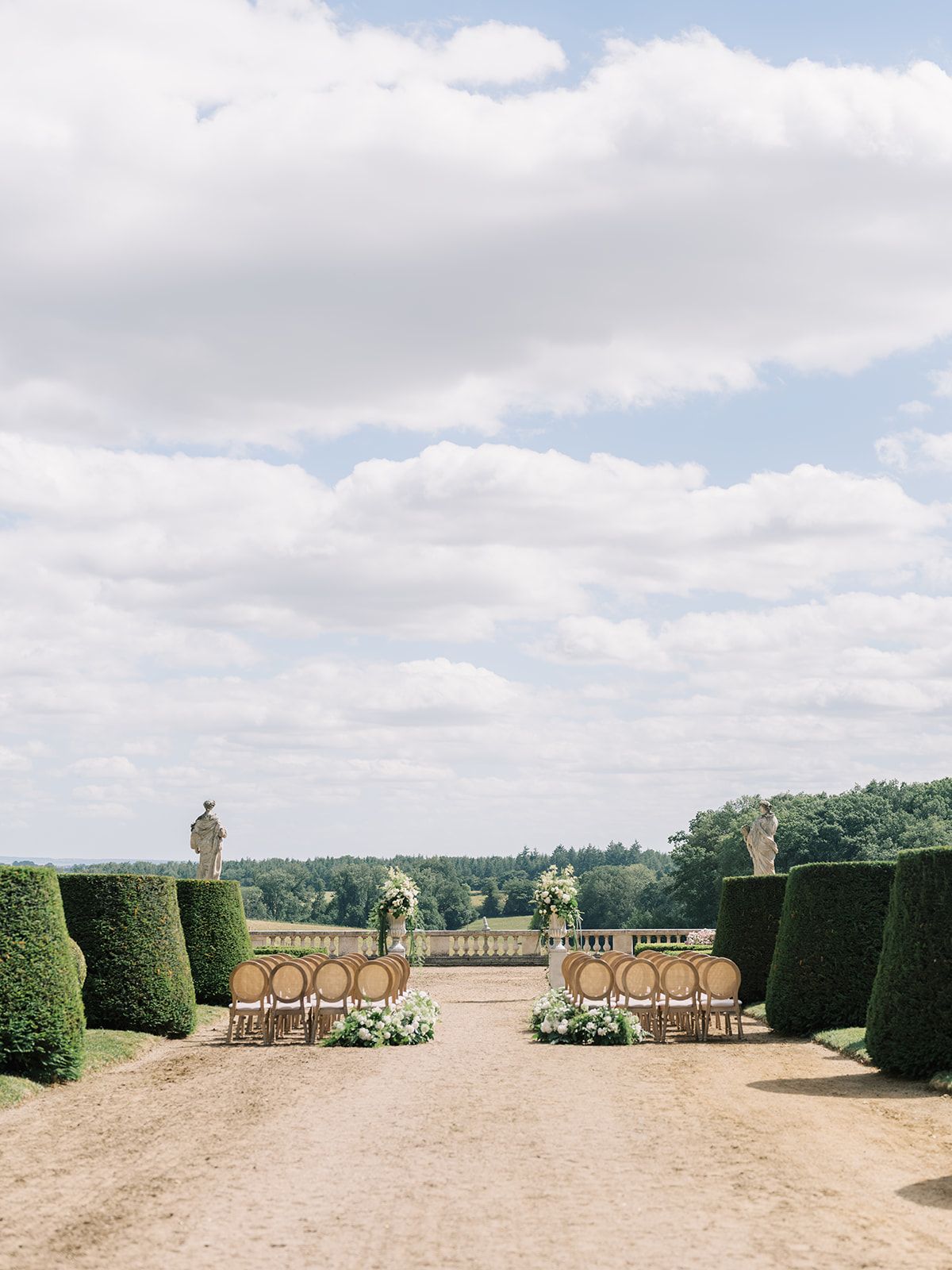 The ceremony set up at the end of the garden allee at La Chassagne
