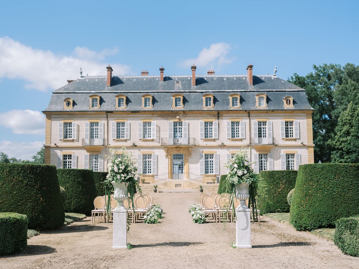 The ceremony set against the chateau facade