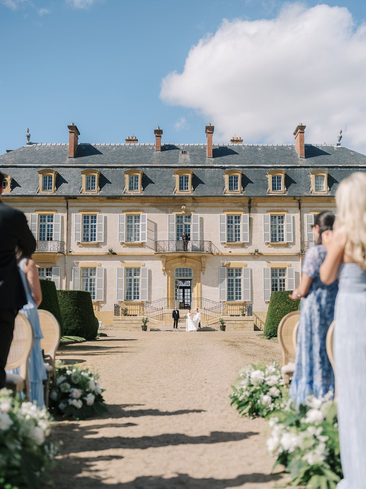 Guests standing at the head of the aisle
