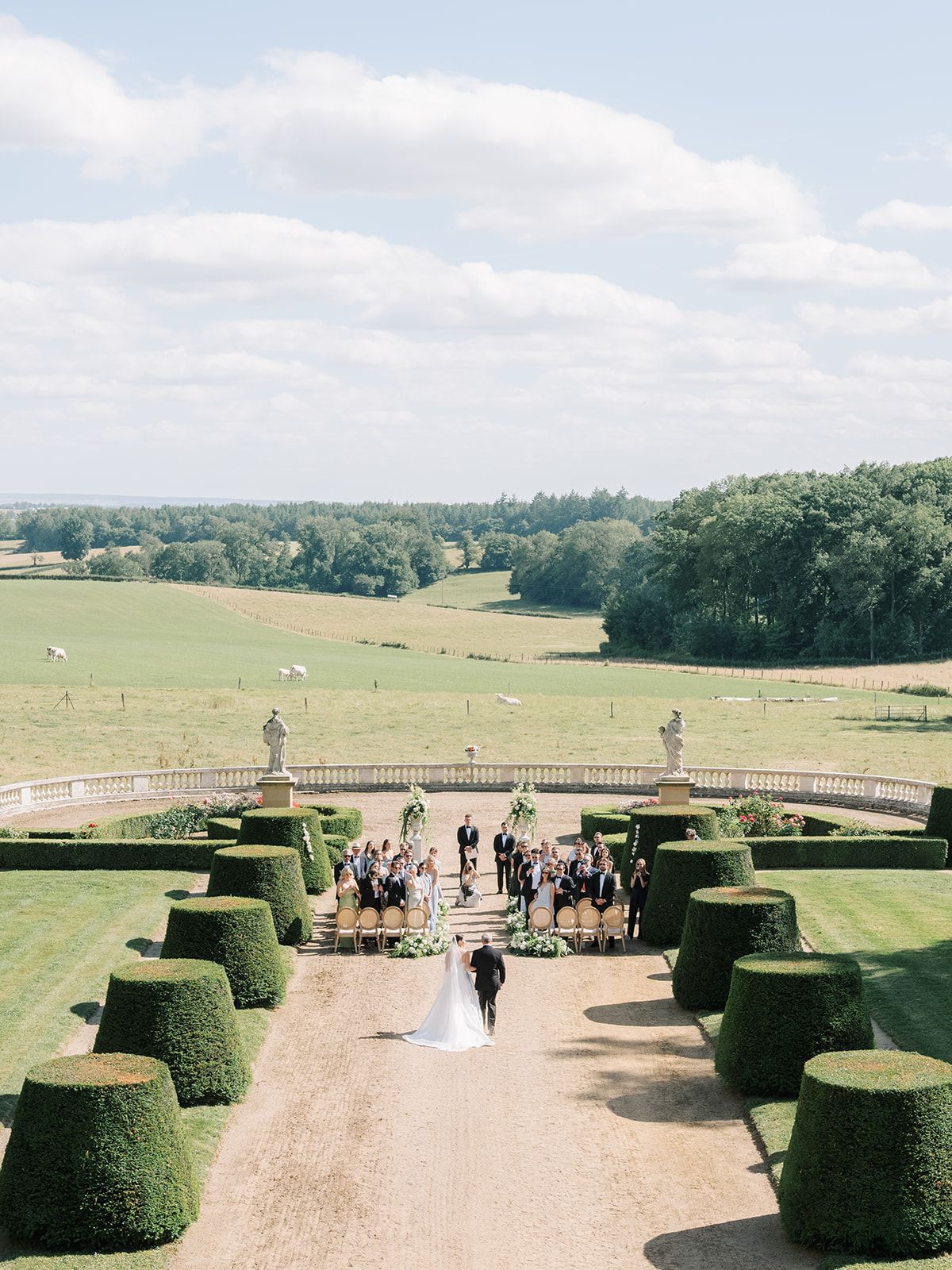 The ceremony seen from above, guests seated either side