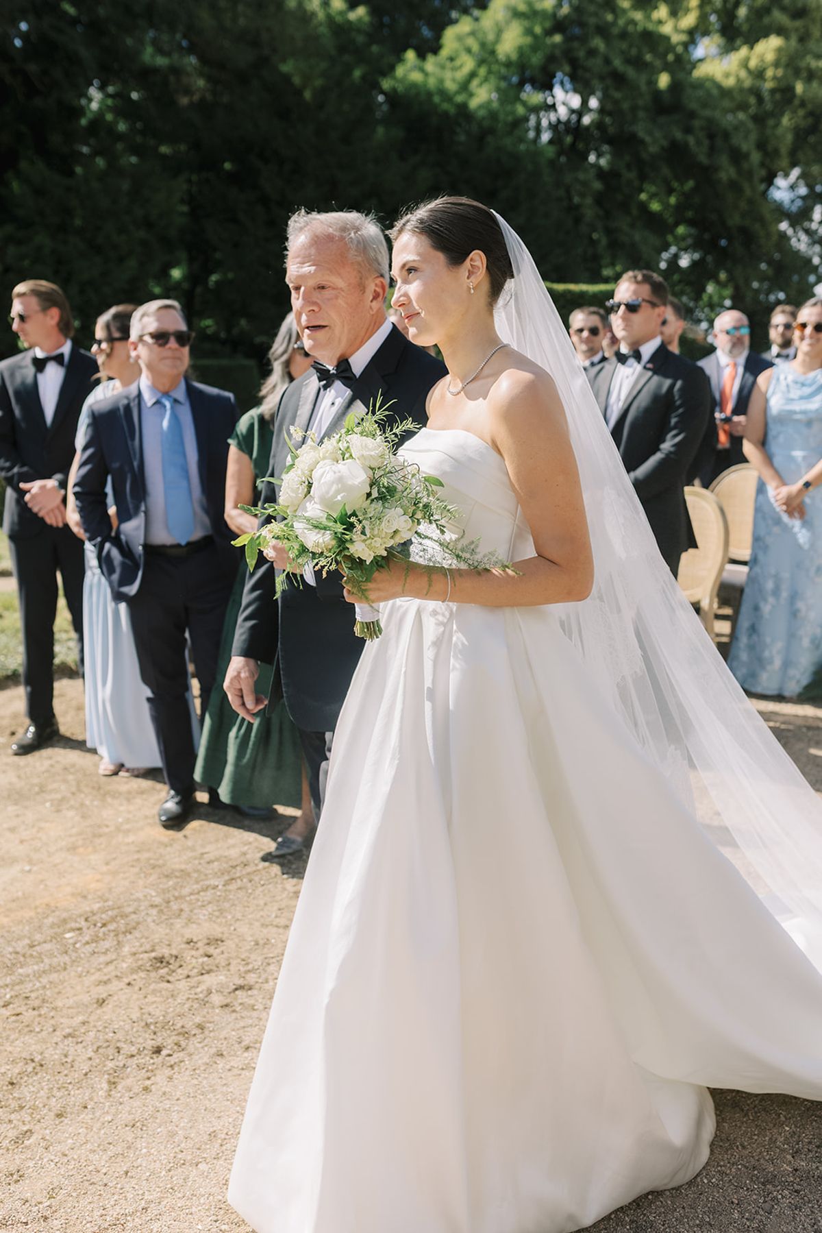 Haley walking up the aisle with her bouquet