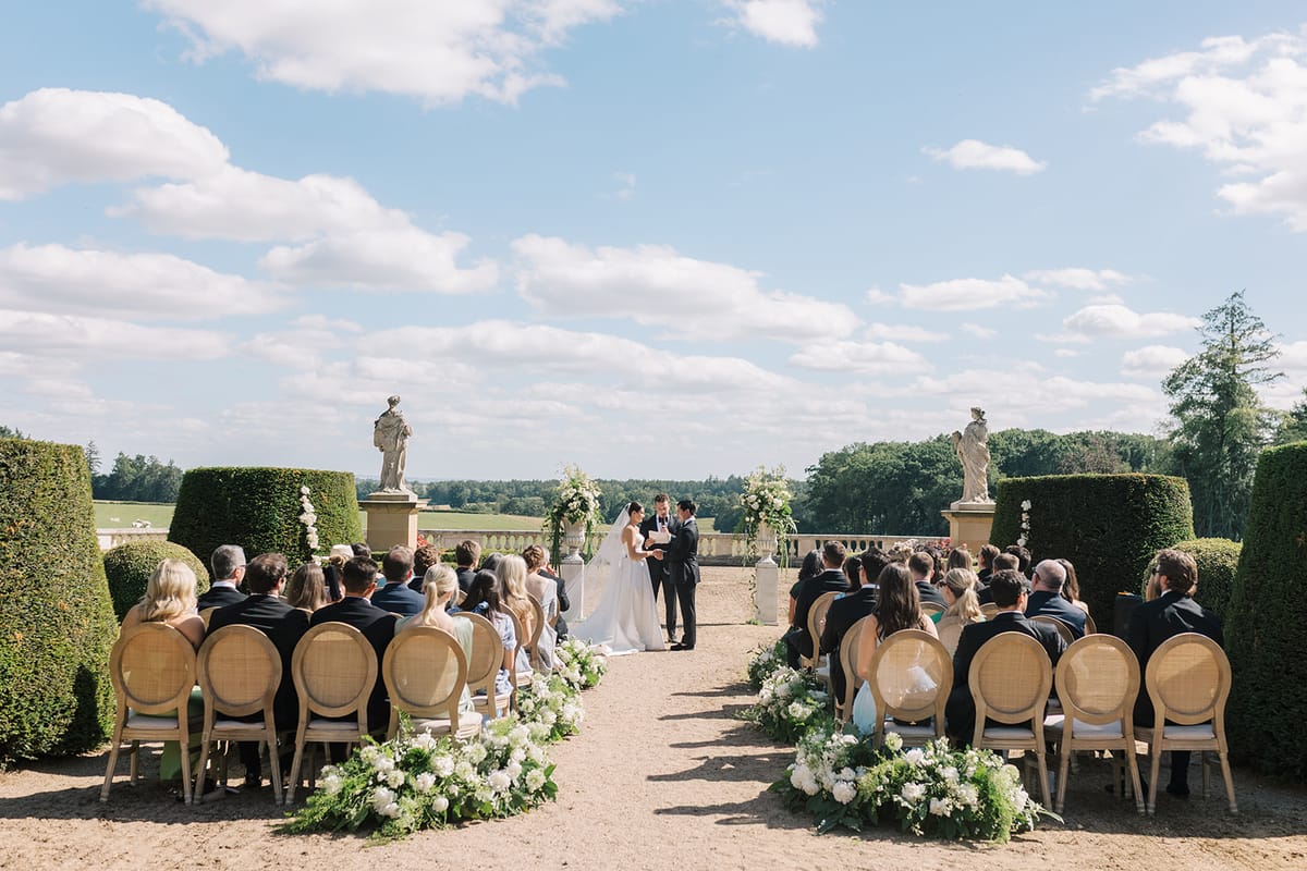 The ceremony with the countryside beyond the balustrade