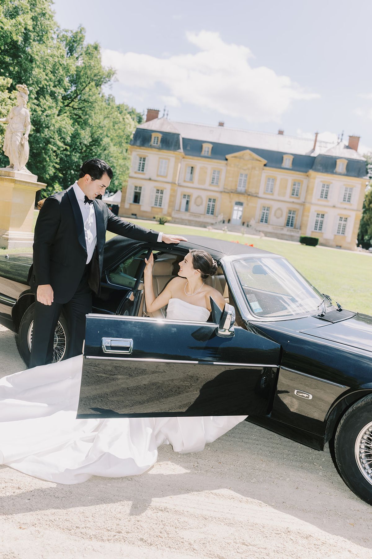 Tyler holding the car door for Haley at La Chassagne