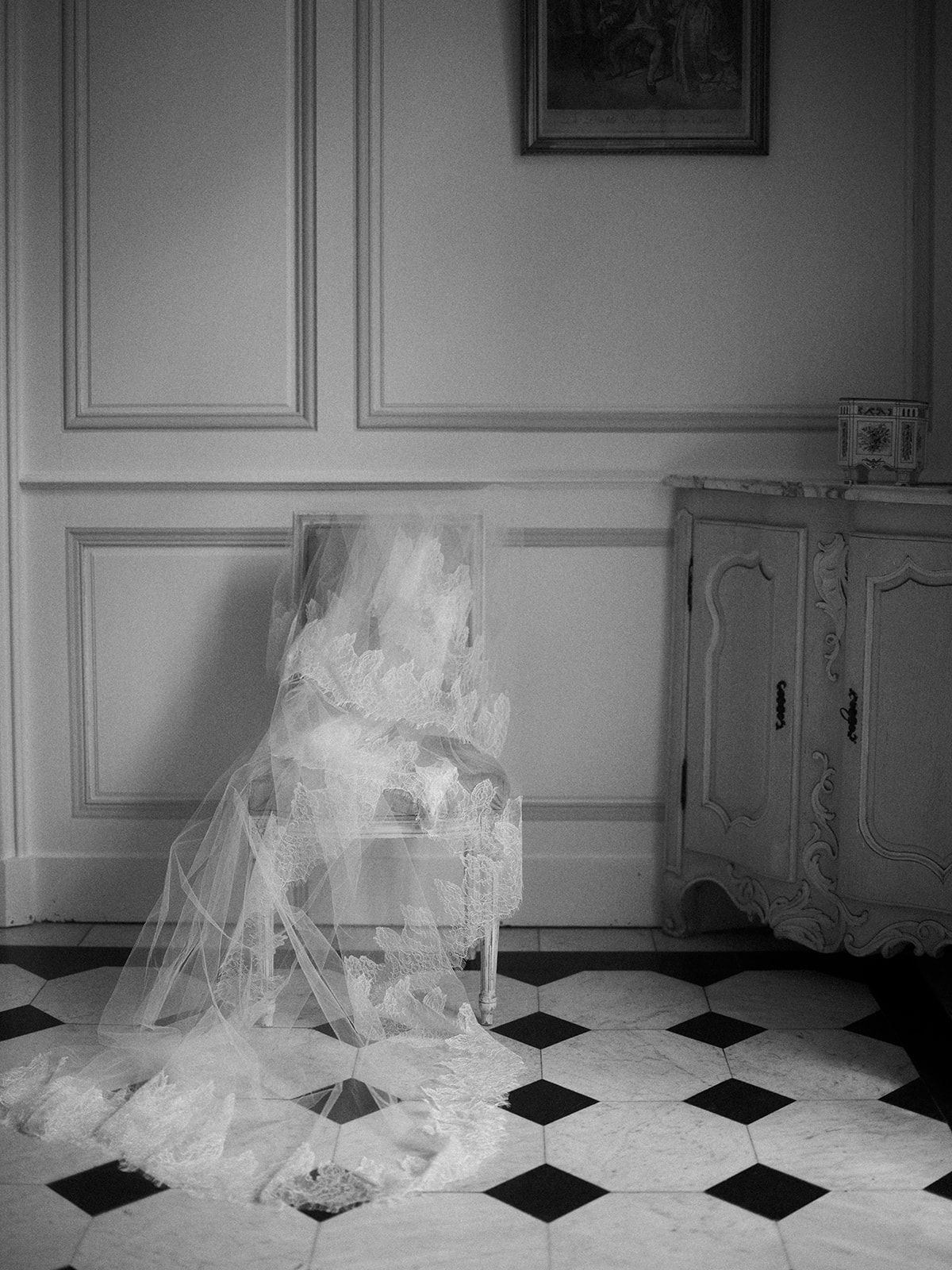 Haley's veil hanging in a panelled room at La Chassagne