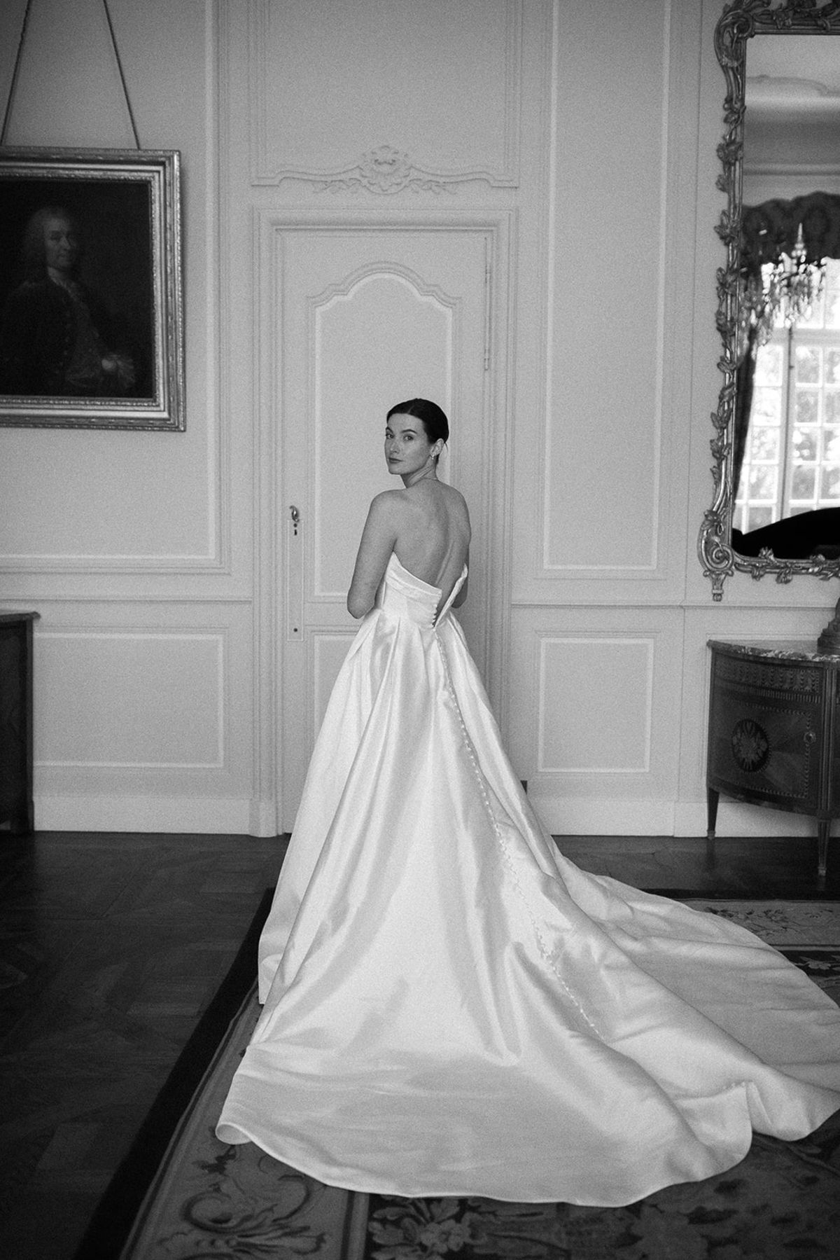 Haley in her gown with the train spread across the floor