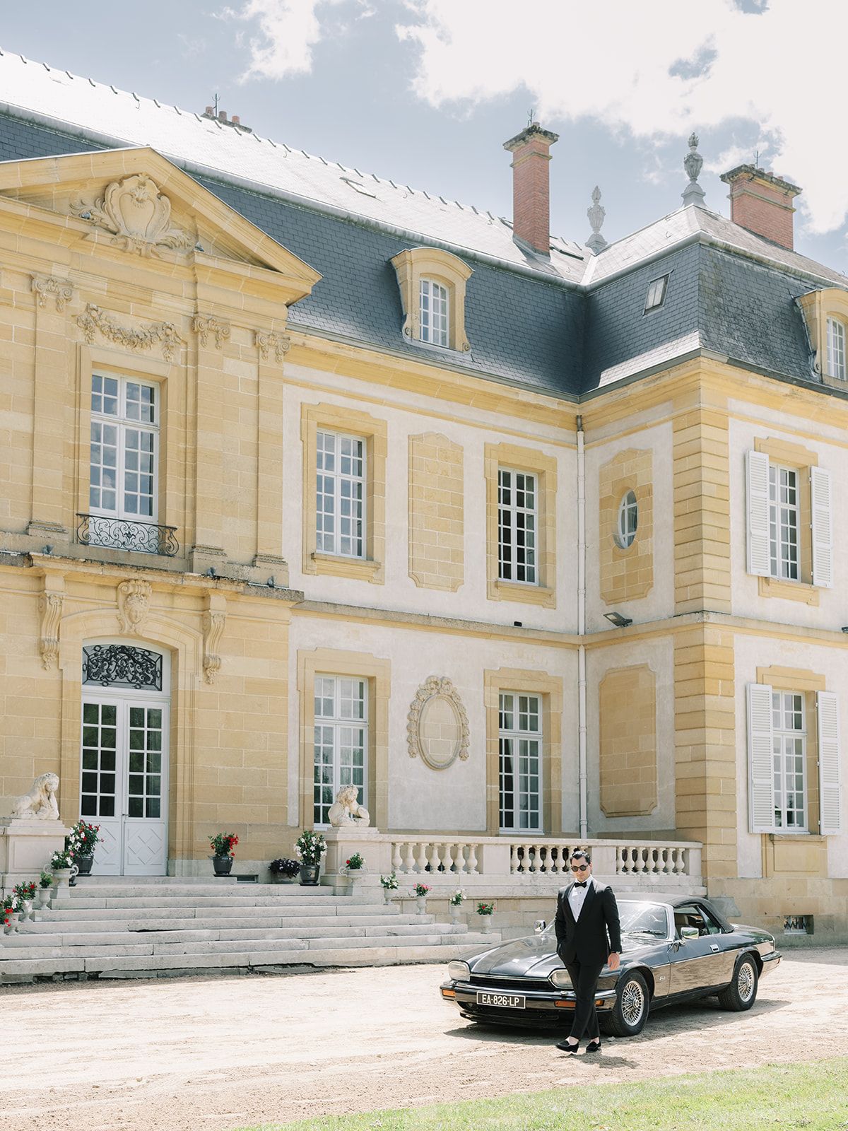 The facade of La Chassagne with the vintage car waiting outside