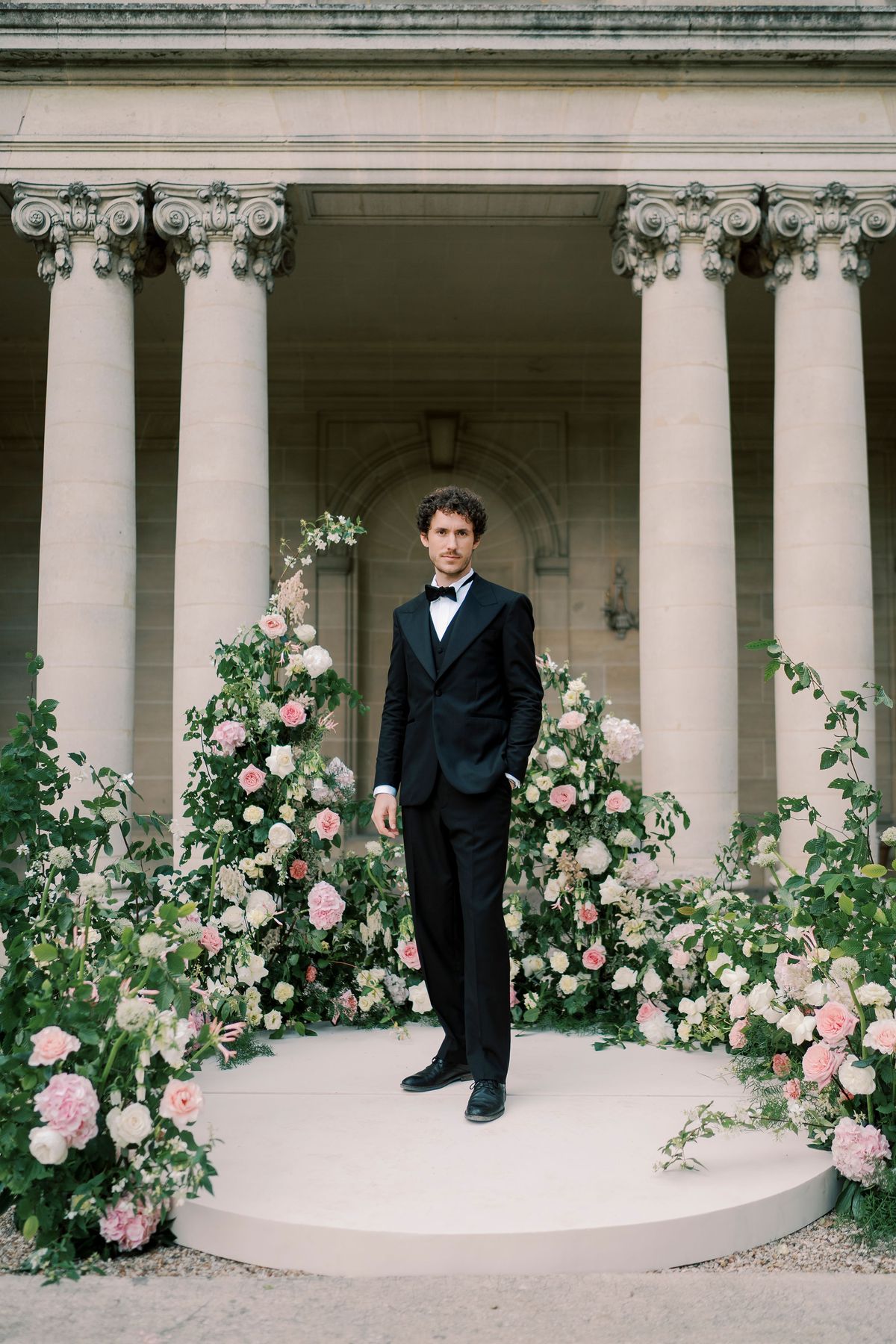 Lucien waiting on the circular ceremony platform before the columned peristyle at Château du Prieuré