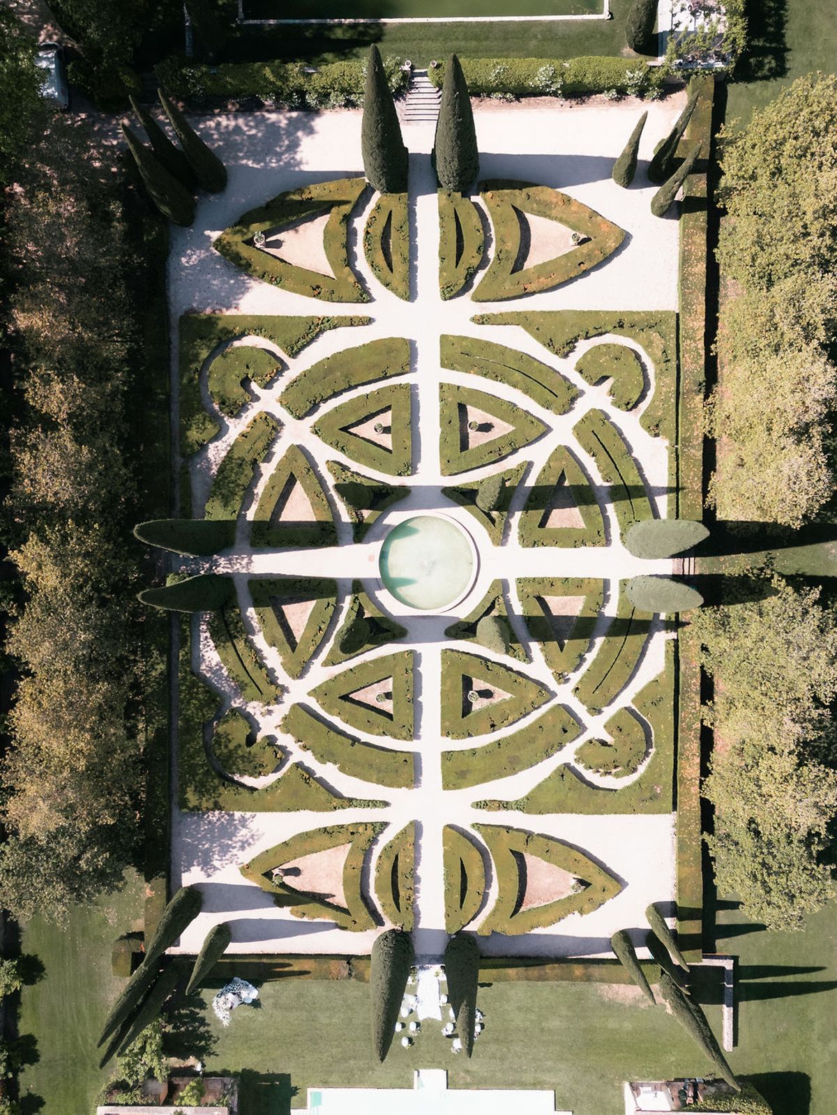 Aerial view directly above the jardin à la française, showing the box parterre pattern and pond at Château de Sannes, Provence