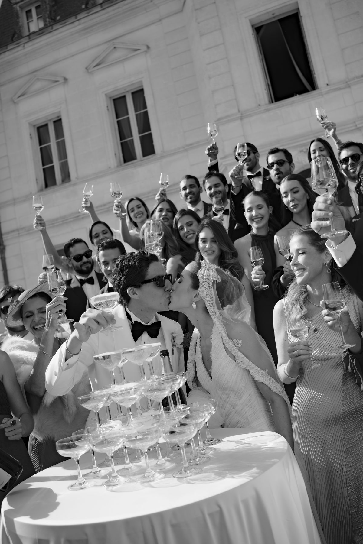 Isadora & Hugo — guests raising their glasses at the champagne tower, spring wedding in Nouvelle-Aquitaine
