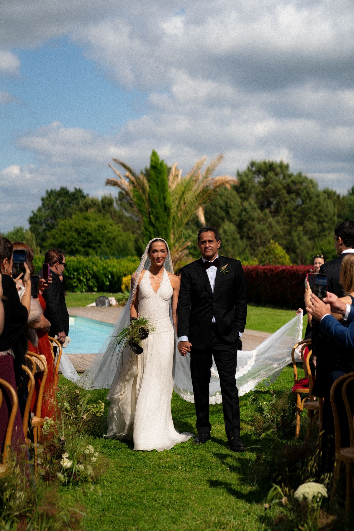 Isadora & Hugo — guests by the poolside before the ceremony, spring wedding in Nouvelle-Aquitaine