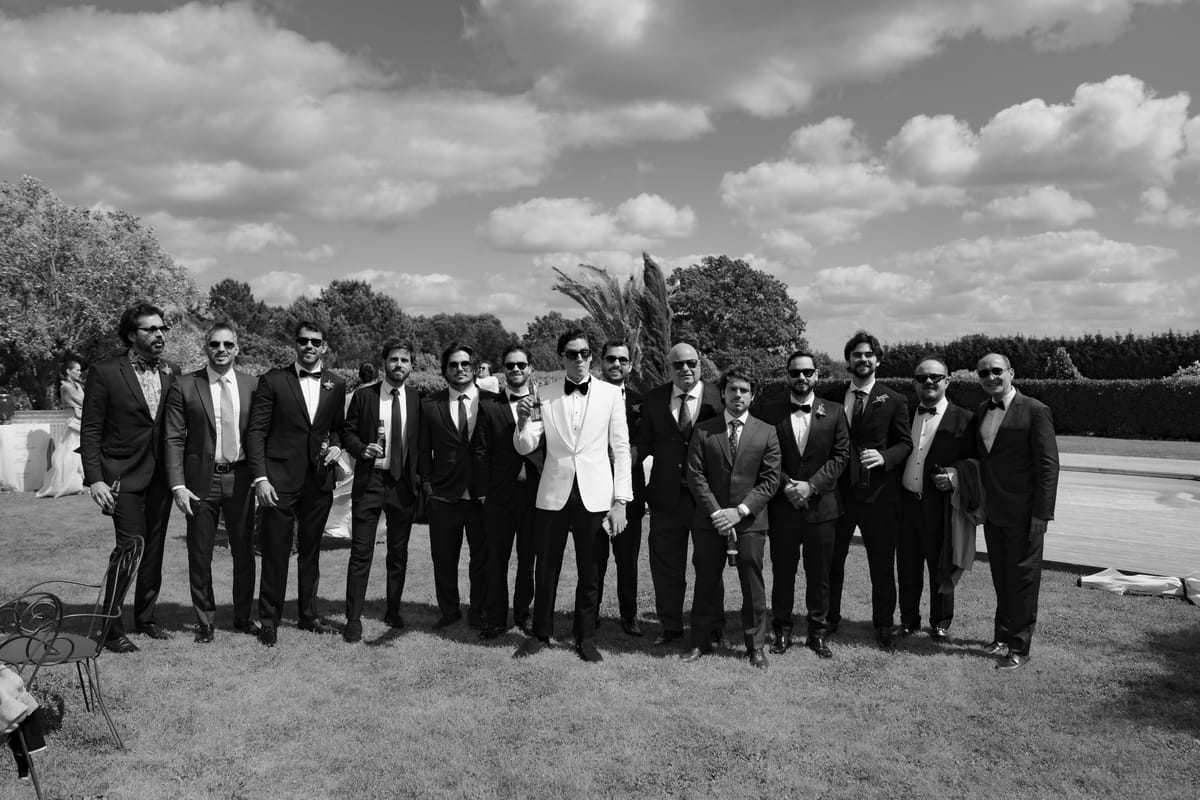 Isadora & Hugo — the groom with his groomsmen in black tie, spring wedding in Nouvelle-Aquitaine