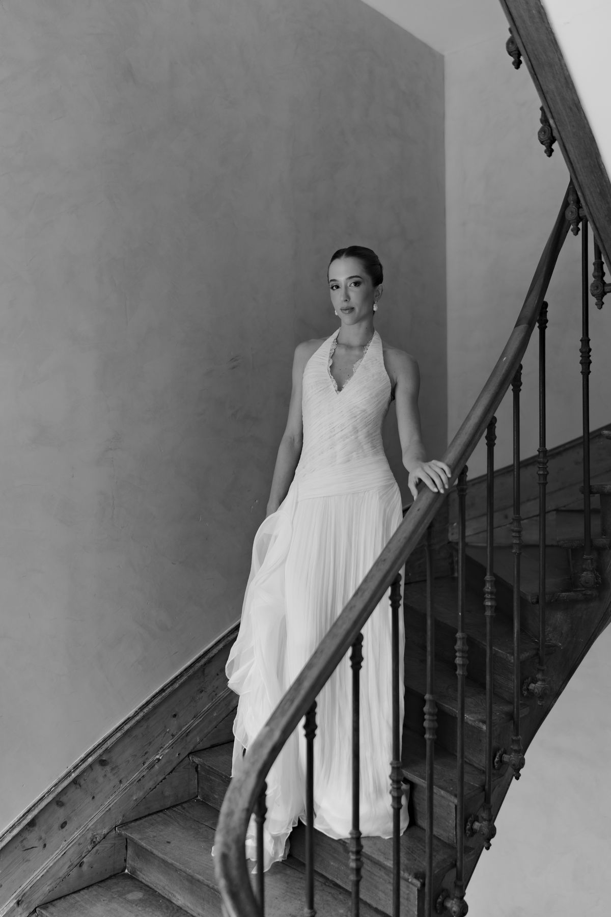 Isadora & Hugo — the bride on the staircase in her gown, spring wedding in Nouvelle-Aquitaine