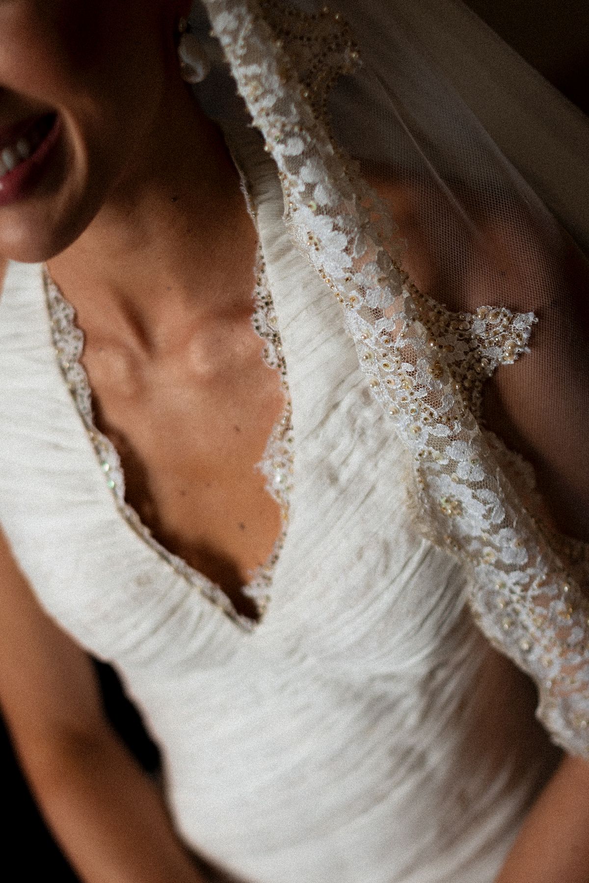 Isadora & Hugo — a close view of the beaded neckline of the bride's gown, spring wedding in Nouvelle-Aquitaine