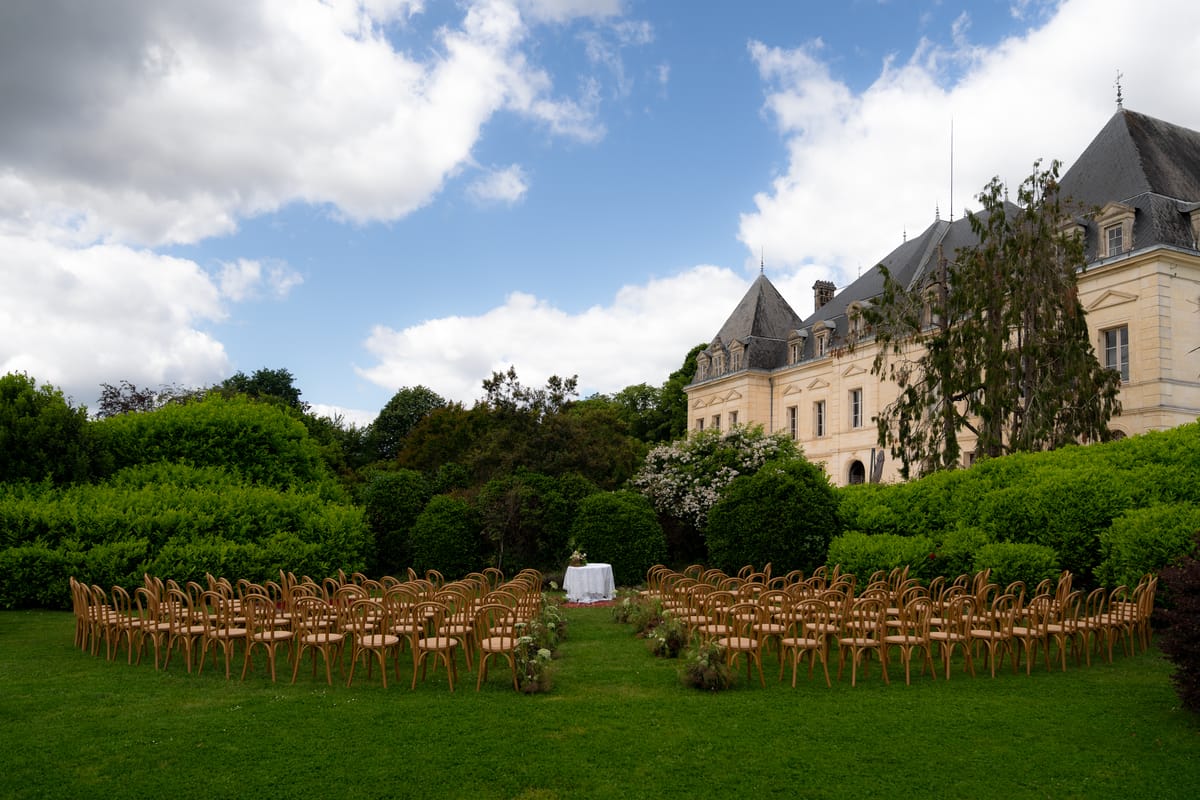 Isadora & Hugo — a wide view of the gardens with the ceremony seating in place, spring wedding in Nouvelle-Aquitaine